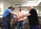 As early voting totals roll into the County courtroom on Tuesday, March 5, Quest Bates, Kendall Funderburk, and Doug Potts shake hands to wish good luck and camaraderie.