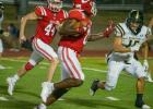 Groesbeck's Kenny Bennett returns a fumble in the third quarter against McGregor on Friday night, Sept. 1, at Groesbeck Stadium. Teammate Colby Menzel (44) follows the action. Bennett's fumble recovery led to a Goat touchdown in a 35-7 victory. Photo by Nuno Selvera/For The Groesbeck Journal